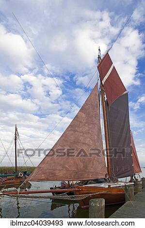 "Zeesen boat with set sails in the harbour of Ahrenshoop, Darss, Mecklenburg-Western Pomerania, Germany, Europe" View Large Photo Image Stock Image - "Zeesen boat with set sails in the harbour of Ahrenshoop, Darss, Mecklenburg-Western Pomerania, Germany, Europe". Fotosearch