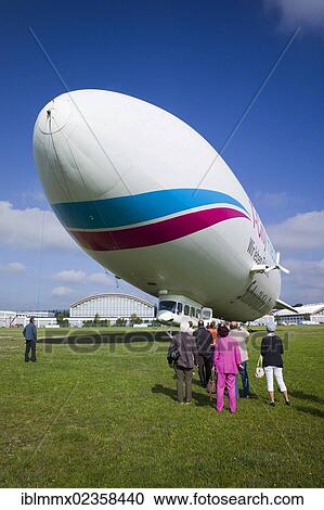 "Zeppelin NT with tourists at the airport, Friedrichshafen, Baden-Wuerttemberg, Germany, Europe" View Large Photo Image Stock Image - "Zeppelin NT with tourists at the airport, Friedrichshafen, Baden-Wuerttemberg, Germany, Europe". Fotosearch