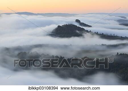 "Zirkelstein Mountain and Kaiserkrone Mountain in the morning mist, Saxon Switzerland, Bad Schandau, Saxon Switzerland region, Saxony, Germany, Europe" View Large Photo Image Picture - "Zirkelstein Mountain and Kaiserkrone Mountain in the morning mist, Saxon Switzerland, Bad Schandau, Saxon Switzerland region, Saxony, Germany, Europe". Fotosearch