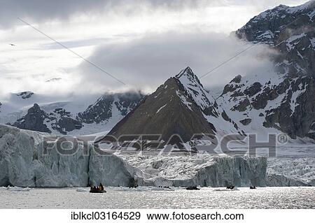 "Zodiac inflatable boat during an expedition cruise in front of Samarinbreen Glacier and Tindegga Mountain, Samarinvagen, Hornsund, Spitsbergen Island, Svalbard Archipelago, Svalbard and Jan Mayen, Norway, Europe" View Large Photo Image Stock Photo - "Zodiac inflatable boat during an expedition cruise in front of Samarinbreen Glacier and Tindegga Mountain, Samarinvagen, Hornsund, Spitsbergen Island, Svalbard Archipelago, Svalbard and Jan Mayen, Norway, Europe". Fotosearch
