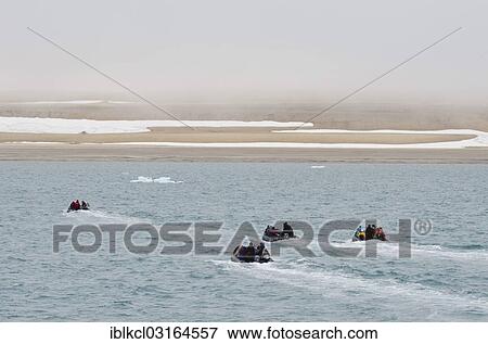 "Zodiac inflatable boats transporting passengers from an expedition cruise to the shore, near Vibebukta, Nordaustlandet, Svalbard Archipelago, Svalbard and Jan Mayen, Norway, Europe" View Large Photo Image Stock Photo - "Zodiac inflatable boats transporting passengers from an expedition cruise to the shore, near Vibebukta, Nordaustlandet, Svalbard Archipelago, Svalbard and Jan Mayen, Norway, Europe". Fotosearch