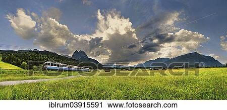"Zugspitze Railway with bizarre cloudy sky and summit of the Grosser Waxenstein, Hammerbach, Garmisch-Partenkirchen District, Upper Bavaria, Bavaria, Germany, Europe" View Large Photo Image Stock Image - "Zugspitze Railway with bizarre cloudy sky and summit of the Grosser Waxenstein, Hammerbach, Garmisch-Partenkirchen District, Upper Bavaria, Bavaria, Germany, Europe". Fotosearch