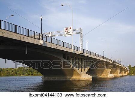 Ahuntsic Bridge, or Viau Bridge, built in 1930, rebuilt in 1962, widened in 1993, spans the Riviere des Prairies between the cities of Laval and Montreal, Quebec, Canada, North America View Large Photo Image Stock Image - Ahuntsic Bridge, or Viau Bridge, built in 1930, rebuilt in 1962, widened in 1993, spans the Riviere des Prairies between the cities of Laval and Montreal, Quebec, Canada, North America. Fotosearch