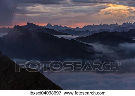 Stock Photo - Allgau mountains with sea of fog at sunrise, Au, Bregenz Forest, Vorarlberg, Austria, Europe. Fotosearch
