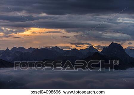Stock Photograph - Allgau mountains with sea of fog at sunrise, Au, Bregenz Forest, Vorarlberg, Austria, Europe. Fotosearch