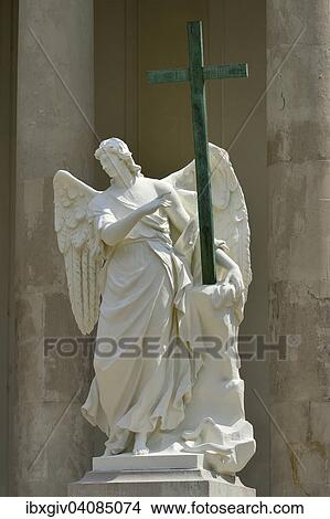 Angel with a cross, sculpture at Karlskirche church, Karlsplatz square, Vienna, Austria, Europe View Large Photo Image Picture - Angel with a cross, sculpture at Karlskirche church, Karlsplatz square, Vienna, Austria, Europe. Fotosearch