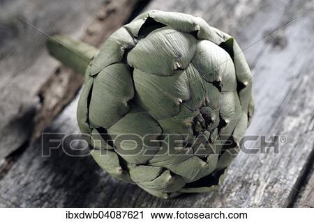 Stock Image - Artichoke on a wooden board. Fotosearch