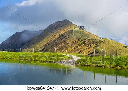 Artificial lake to feed water to the snow cannons for the slopes of the Fellhornbahn and Kanzelwandbahn, Fellhorn behind, 2038m, Allgau Alps, Bavaria, Germany, Europe View Large Photo Image Stock Image - Artificial lake to feed water to the snow cannons for the slopes of the Fellhornbahn and Kanzelwandbahn, Fellhorn behind, 2038m, Allgau Alps, Bavaria, Germany, Europe. Fotosearch