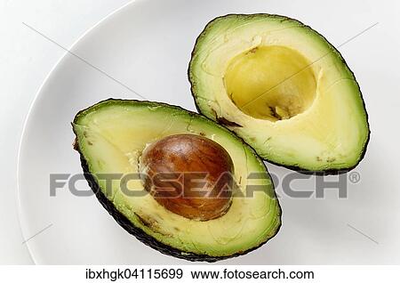 Avocado, halved View Large Photo Image Stock Photo - Avocado, halved. Fotosearch