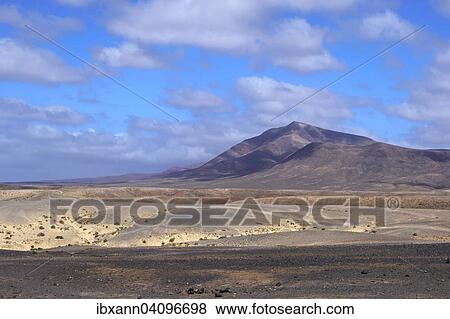 Barren landscape in the Monumento Natural de los Ajaches natural park, Lanzarote, Canary Islands, Spain, Europe View Large Photo Image Stock Photo - Barren landscape in the Monumento Natural de los Ajaches natural park, Lanzarote, Canary Islands, Spain, Europe. Fotosearch