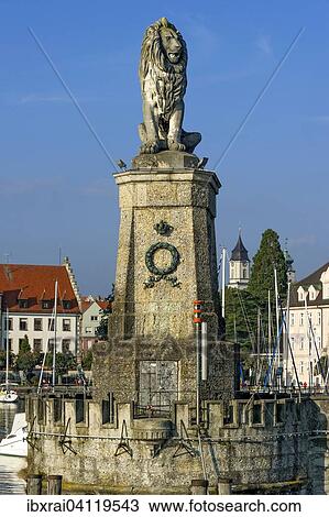 Bavarian Lion at the port entrance, Notre-Dame Cathedral behind, port, Lake Constance, Lindau, Swabia, Bavaria, Germany, Europe View Large Photo Image Stock Image - Bavarian Lion at the port entrance, Notre-Dame Cathedral behind, port, Lake Constance, Lindau, Swabia, Bavaria, Germany, Europe. Fotosearch