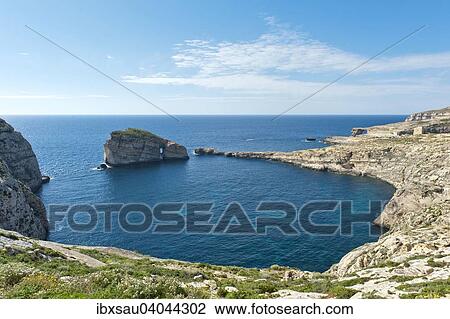 Bay with Fungus Rock and the Azure Window, limestone known as Lower Corallian, Dwejra Bay and Dwejra Point, West Coast, Gozo, Malta, Europe View Large Photo Image Stock Image - Bay with Fungus Rock and the Azure Window, limestone known as Lower Corallian, Dwejra Bay and Dwejra Point, West Coast, Gozo, Malta, Europe. Fotosearch