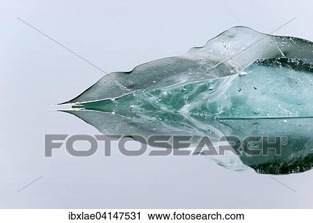 Stock Image - Block of ice floating in water, Jokulsarlon, Hornafjorour, Austurland, Iceland, Europe. Fotosearch