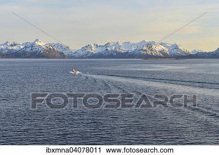 Boat entering the Sortlandsund, behind snow-capped mountain peaks, Sortlandsund, Nordland, Vesteralen, Norway, Europe View Large Photo Image Stock Image - Boat entering the Sortlandsund, behind snow-capped mountain peaks, Sortlandsund, Nordland, Vesteralen, Norway, Europe. Fotosearch