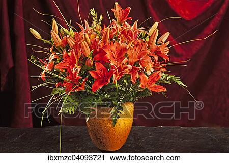 Bouquet of lilies, vase in front of a red curtain View Large Photo Image Stock Image - Bouquet of lilies, vase in front of a red curtain. Fotosearch