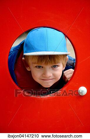 Stock Image - Boy, 5 years, on a playground, Ystad, Sweden, Europe. Fotosearch