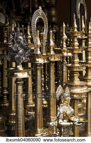 Brass stands for oil lamps, Ganesha sculpture, Mannar, Kerala, India, Asia View Large Photo Image Stock Image - Brass stands for oil lamps, Ganesha sculpture, Mannar, Kerala, India, Asia. Fotosearch