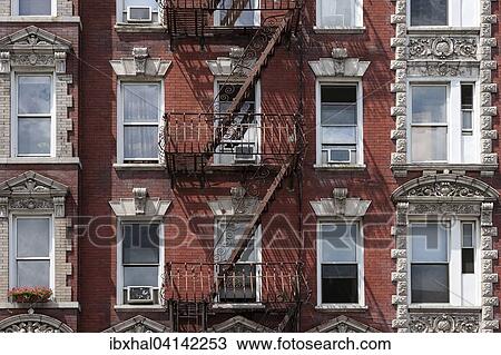 Stock Image - Building with fire escapes, Manhattan, New York, USA. Fotosearch