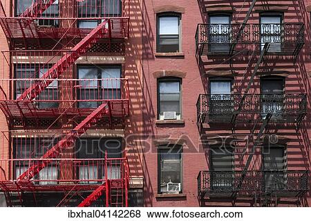 Building with fire escapes, Manhattan, New York, USA View Large Photo Image Stock Photo - Building with fire escapes, Manhattan, New York, USA. Fotosearch