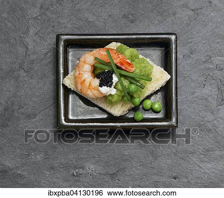 Canape on a slate plate View Large Photo Image Stock Photograph - Canape on a slate plate. Fotosearch