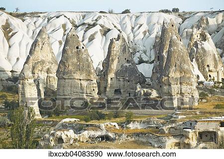 Stock Image - Cave dwellings and tufa formations, Goreme, Nevsehir Province, Cappadocia, Anatolia, Turkey, Asia. Fotosearch