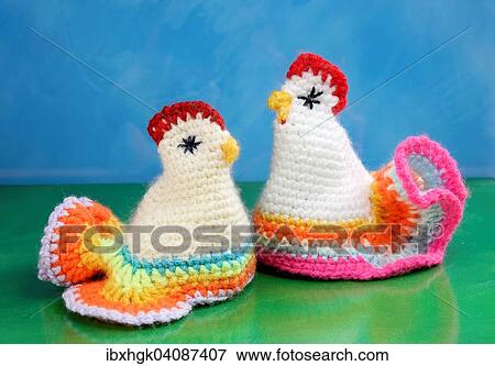 Stock Photo - Chicken, egg cozies, crocheted. Fotosearch