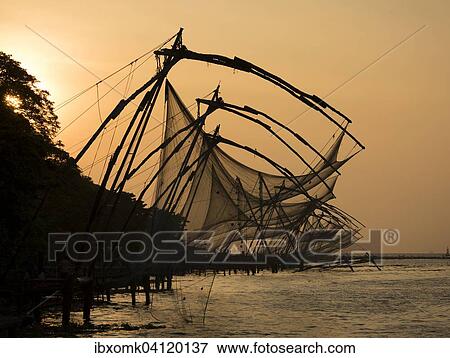 Stock Photo - Chinese fishing nets, sunset, Arabian Sea coast, Kochi, Kerala, South India, India, Asia. Fotosearch