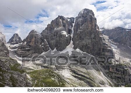 Cima Tosa with the famous Canalone Cima Tosa couloir, 3173 m, the highest peak of the Brenta group, Brenta alta high valley in front, view from the via ferrata Bocchette Alte, Dolomites, Trentino Province, Italy, Europe View Large Photo Image Stock Image - Cima Tosa with the famous Canalone Cima Tosa couloir, 3173 m, the highest peak of the Brenta group, Brenta alta high valley in front, view from the via ferrata Bocchette Alte, Dolomites, Trentino Province, Italy, Europe. Fotosearch