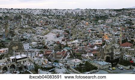 Stock Image - Cityscape in the evening light, Goreme, Nevsehir Province, Cappadocia, Anatolia, Turkey, Asia. Fotosearch