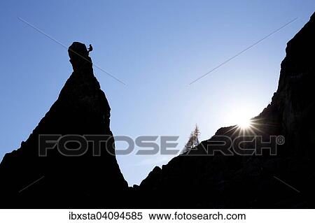 Climber on a cliff in the evening light at Savoy Alps, backlit, Chamonix, France, Europe View Large Photo Image Stock Photography - Climber on a cliff in the evening light at Savoy Alps, backlit, Chamonix, France, Europe. Fotosearch