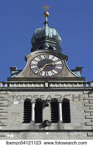 Stock Image - Clock tower of the Basilica of St. Emmeram against blue sky, Regensburg, Upper Palatinate, Bavaria, Germany, Europe. Fotosearch