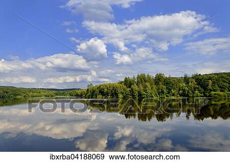 Clouds reflected in Mohnesee, Mohnetalsperre, North Rhine-Westphalia, Germany, Europe View Large Photo Image Stock Photo - Clouds reflected in Mohnesee, Mohnetalsperre, North Rhine-Westphalia, Germany, Europe. Fotosearch