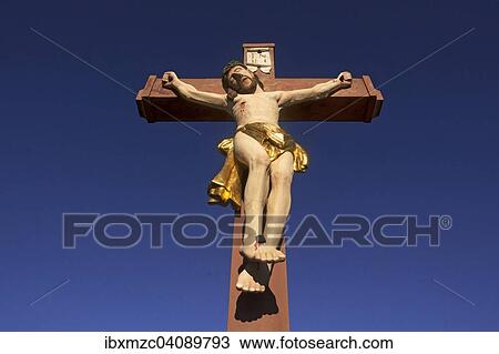 Colored stone crucifix, against a blue sky, Ringsheim, Baden-Wurttemberg, Germany, Europe View Large Photo Image Stock Image - Colored stone crucifix, against a blue sky, Ringsheim, Baden-Wurttemberg, Germany, Europe. Fotosearch