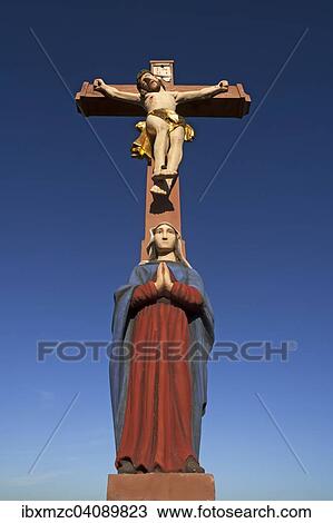 Colored stone crucifix with Mary, against a blue sky, Ringsheim, Baden-Wurttemberg, Germany, Europe View Large Photo Image Stock Image - Colored stone crucifix with Mary, against a blue sky, Ringsheim, Baden-Wurttemberg, Germany, Europe. Fotosearch