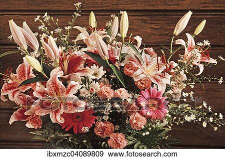 Colorful flower bouquet with roses, lilies and carnations in front of wooden wall View Large Photo Image Stock Photo - Colorful flower bouquet with roses, lilies and carnations in front of wooden wall. Fotosearch