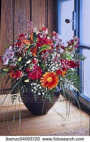 Colorful summer bouquet in a vase in front of a wooden wall by a window View Large Photo Image Stock Image - Colorful summer bouquet in a vase in front of a wooden wall by a window. Fotosearch