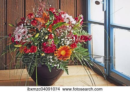Colorful summer bouquet in a vase against a wooden wall by the window View Large Photo Image Picture - Colorful summer bouquet in a vase against a wooden wall by the window. Fotosearch