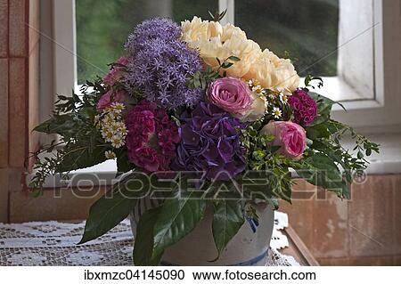 Colourful spring bouquet in front of window View Large Photo Image Stock Image - Colourful spring bouquet in front of window. Fotosearch
