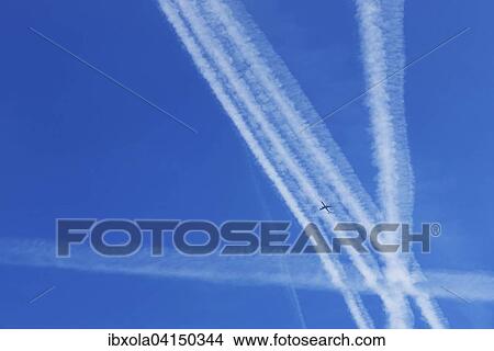 Picture - Contrails of airplanes in the sky, Germany, Europe. Fotosearch