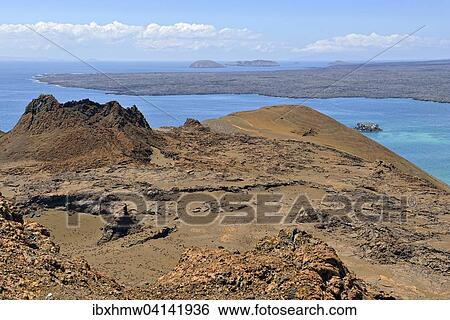 Craters and lava formations, view from the lighthouse on Bartolome Islands over parts of the western peninsula, Santiago Island, also San Salvador Island, and other islands behind, Galapagos Province, Galapagos Islands, Ecuador, South America View Large Photo Image Stock Photograph - Craters and lava formations, view from the lighthouse on Bartolome Islands over parts of the western peninsula, Santiago Island, also San Salvador Island, and other islands behind, Galapagos Province, Galapagos Islands, Ecuador, South America. Fotosearch
