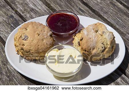 Cream tea, scones with clotted cream and strawberry jam, Devon, southern England, England, United Kingdom, Europe View Large Photo Image Stock Image - Cream tea, scones with clotted cream and strawberry jam, Devon, southern England, England, United Kingdom, Europe. Fotosearch