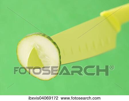 Cucumber slice on a green knife View Large Photo Image Stock Image - Cucumber slice on a green knife. Fotosearch
