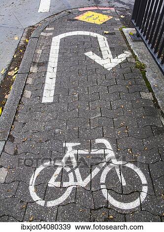 Stock Photo - Cycle path marking on a pavement. Fotosearch