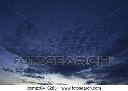 Dark fleecy clouds, cirrocumulus, evening sky View Large Photo Image Stock Image - Dark fleecy clouds, cirrocumulus, evening sky. Fotosearch