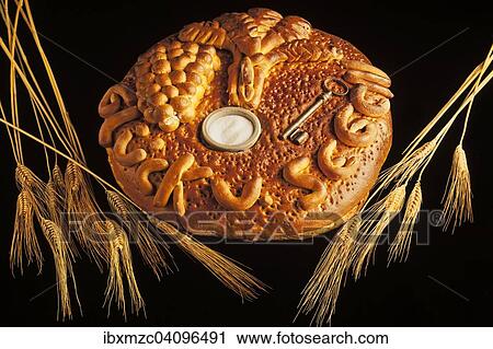 Decorated bread loaf with a key and salt shaker baked into the bread, traditional gift for a house move View Large Photo Image Stock Image - Decorated bread loaf with a key and salt shaker baked into the bread, traditional gift for a house move. Fotosearch