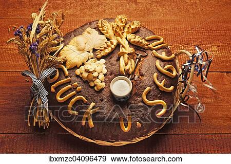Decorated bread loaf with a salt shaker, traditional gift for a house move View Large Photo Image Stock Photo - Decorated bread loaf with a salt shaker, traditional gift for a house move. Fotosearch