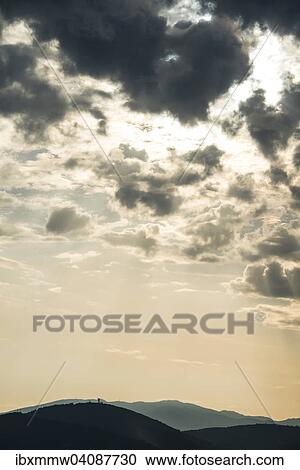 Dramatic clouds and silhouette of hills, twilight, Tuscany, Italy, Europe View Large Photo Image Stock Image - Dramatic clouds and silhouette of hills, twilight, Tuscany, Italy, Europe. Fotosearch