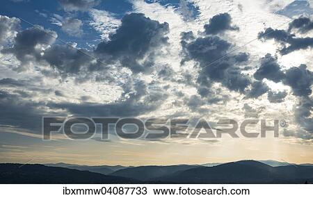 Dramatic clouds and silhouette of hills, twilight, Tuscany, Italy, Europe View Large Photo Image Stock Image - Dramatic clouds and silhouette of hills, twilight, Tuscany, Italy, Europe. Fotosearch