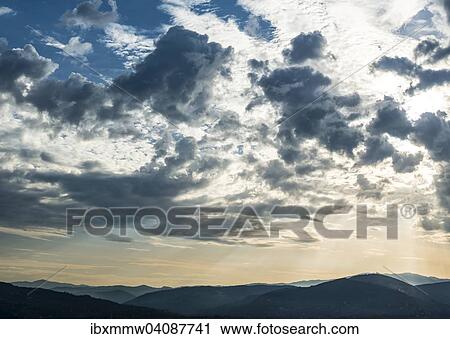 Dramatic clouds and silhouette of hills, twilight, Tuscany, Italy, Europe View Large Photo Image Stock Image - Dramatic clouds and silhouette of hills, twilight, Tuscany, Italy, Europe. Fotosearch