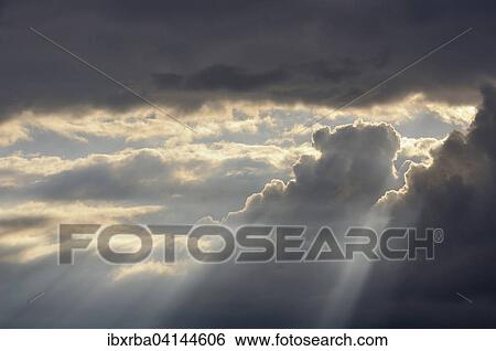 Dramatic cloudy sky with sun rays, Baden-Wurttemberg, Germany, Europe View Large Photo Image Stock Photograph - Dramatic cloudy sky with sun rays, Baden-Wurttemberg, Germany, Europe. Fotosearch